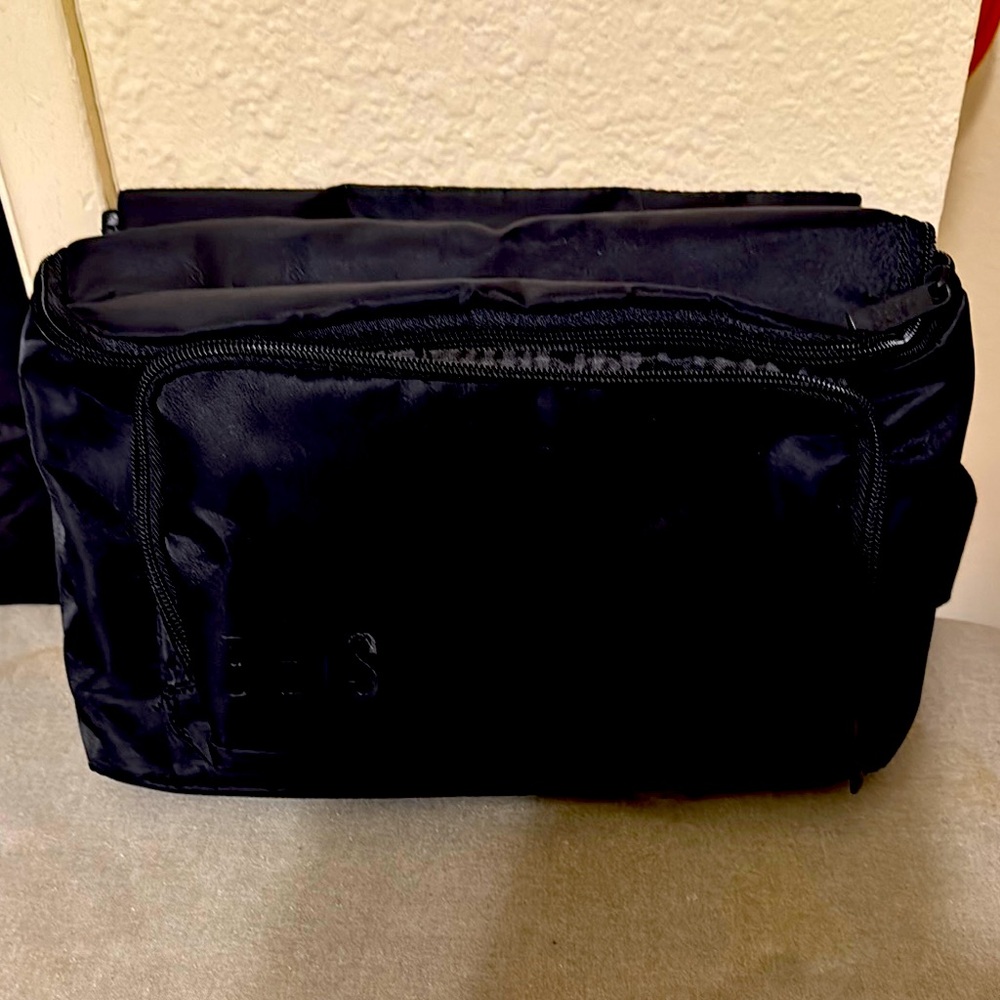 Black Toiletry Bag with Multiple Compartments and Textured Fabric